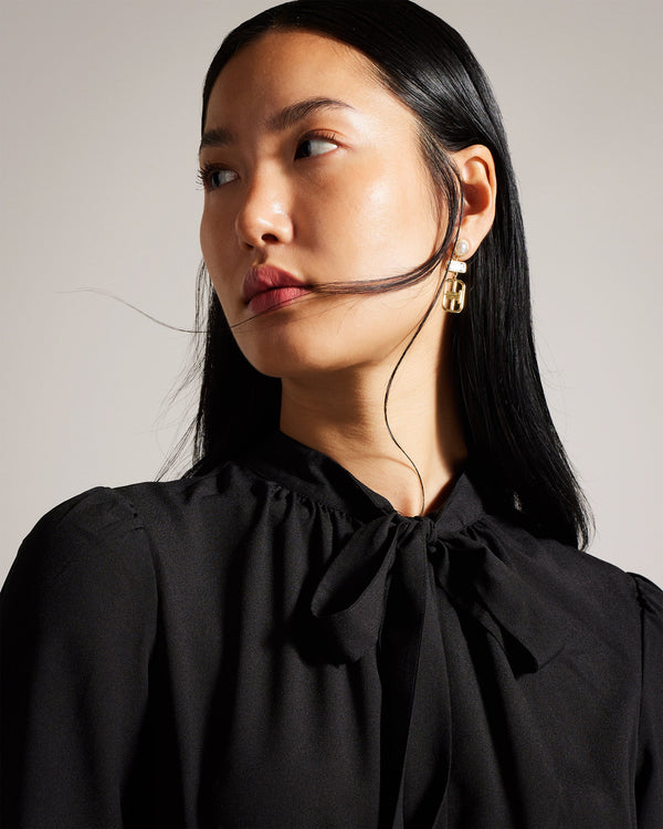 MERSEA-Dresses-Featuring a knitted pencil skirt and a chic shirt bodice, this dress effortlessly blends sophistication and comfort. MERSEA's long sleeves and stand collar add a touch of classic charm, while the button-up front and neck tie create a look that's both versatile and stylish. Midi dress Knitted pencil skirt Shirt bodice Long sleeves Stand collar Button up front Neck tie Length: 118cm- Ted Baker Romania